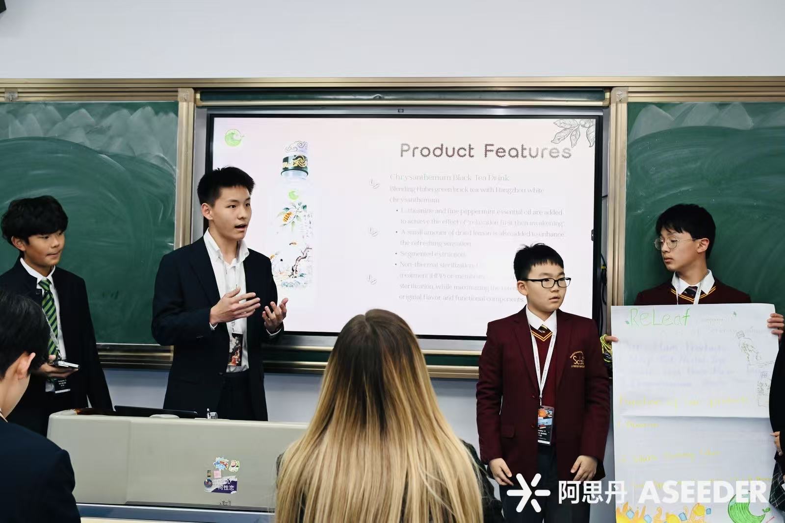 George presenting at ASEEDER — centre stage with judges listening