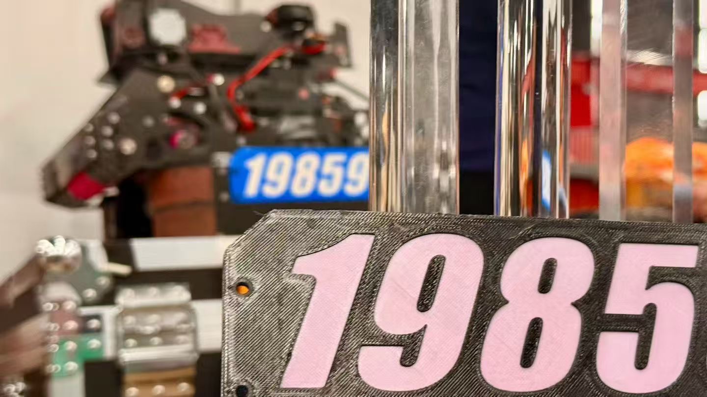 Robot #1985 — FTC IK19859 competition number plate close-up